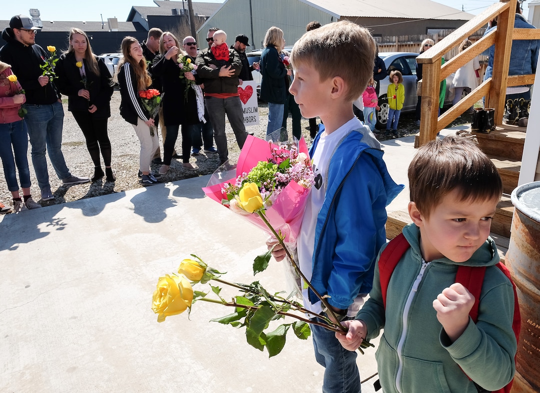 (Francisco Kjolseth  |  The Salt Lake Tribune)  Cousins Calvin Craig, 9, and Golden Sharp, 5, gather outside of the Al Sahaba Mosque in Orem with flowers in a show of love and support for Muslim community following the tragic events in New Zealand. Utah County Commissioner Tanner Ainge organized a "flash mob of solidarity," on Friday, March 15, 2019. 
