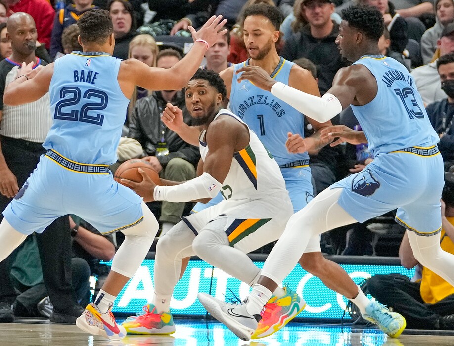 (Leah Hogsten | The Salt Lake Tribune) Utah Jazz guard Donovan Mitchell (45) is pressured by Memphis Grizzlies guard Desmond Bane (22), Memphis Grizzlies forward Kyle Anderson (1) and Memphis Grizzlies forward Jaren Jackson Jr. (13) as the Utah Jazz host the Memphis Grizzlies, Nov. 22, 2021 at Viviant Arena.