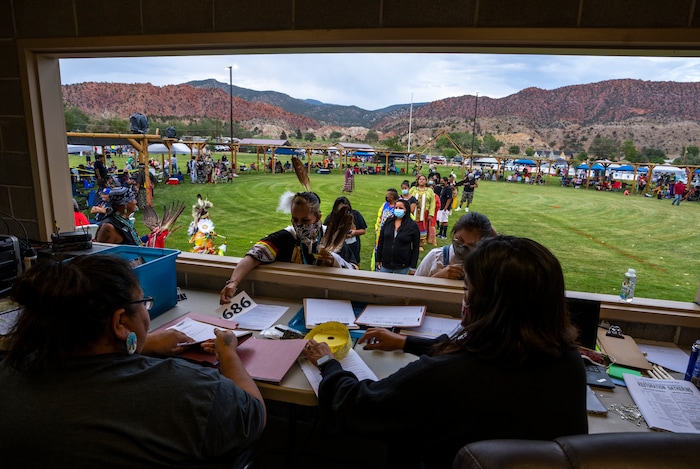 (Leah Hogsten | The Salt Lake Tribune Tribal members from across the West register to compete in the dances at the 41st Annual Paiute Indian Tribe of Utah Restoration Gathering, Aug. 13, 2021 in Cedar City, Utah.