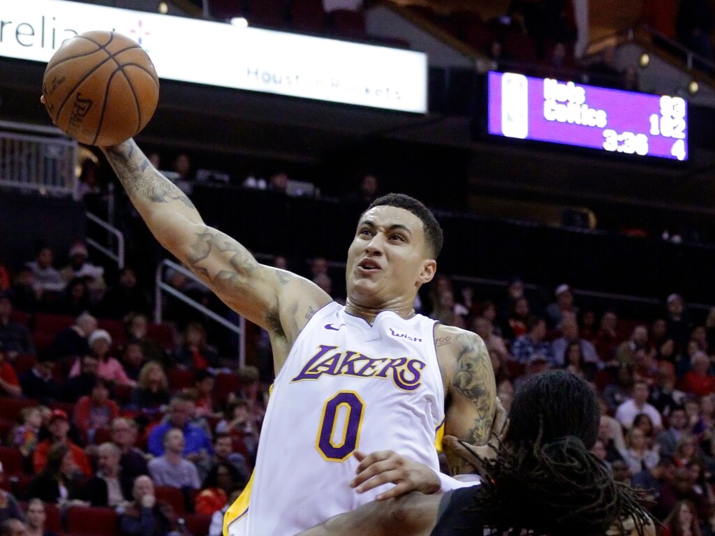Los Angeles Lakers forward Kyle Kuzma (0) shoots over Houston Rockets center Nene (42) in the first half of an NBA basketball game Sunday, Dec. 31, 2017, in Houston. (AP Photo/Michael Wyke)