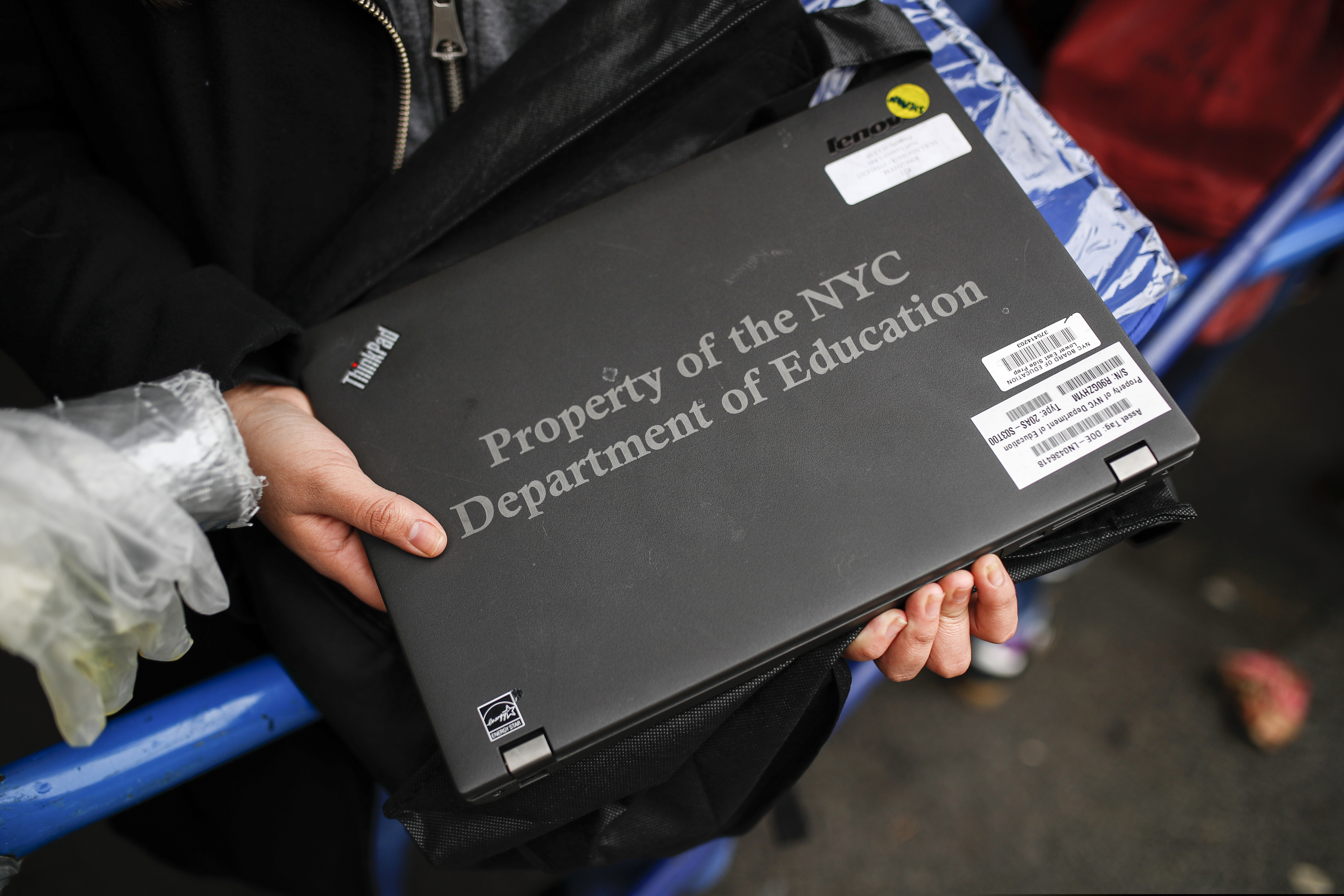(John Minchillo | AP photo)

Anna Louisa, 18, receives her school laptop for home study at the Lower East Side Preparatory School March 19, in New York, as coronavirus restrictions shuttered classrooms throughout the city.