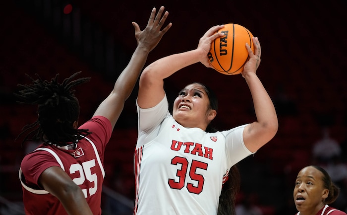 (Francisco Kjolseth | The Salt Lake Tribune) Utah Utes forward Alissa Pili (35) shoots over Oklahoma Sooners forward Madi Williams (25) as the University of Utah hosts the Oklahoma Sooners in women’s NCAA basketball in Salt Lake City on Wednesday, Nov. 16, 2022.