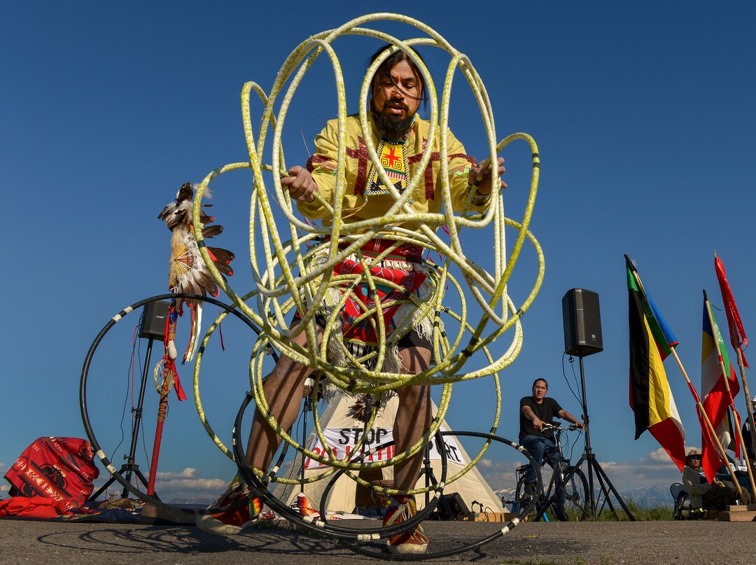 Leah Hogsten  |  The Salt Lake Tribune  Carl Moore, a Hopi and Chemehuevi Native American performs a hoop dance in honor of Mother Earth. Moore also made offerings, sang and gave a prayer during the May Day celebration. The "Stop the Polluting Port" community coalition staged a May Day celebration, calling for respect and awareness of the water, earth and air regarding the 20,000 acres west of Salt Lake City where the inland port industrial site has been proposed.