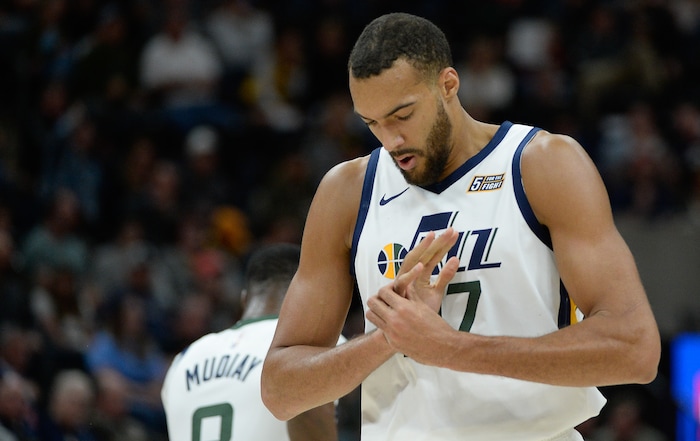 (Francisco Kjolseth  |  The Salt Lake Tribune)  Utah Jazz center Rudy Gobert (27) momentarily injures his finger as the Utah Jazz host the Portland Trailblazers in their NBA basketball game at Vivint Smart Home Arena in Salt Lake City on Wed. Oct. 16, 2019.