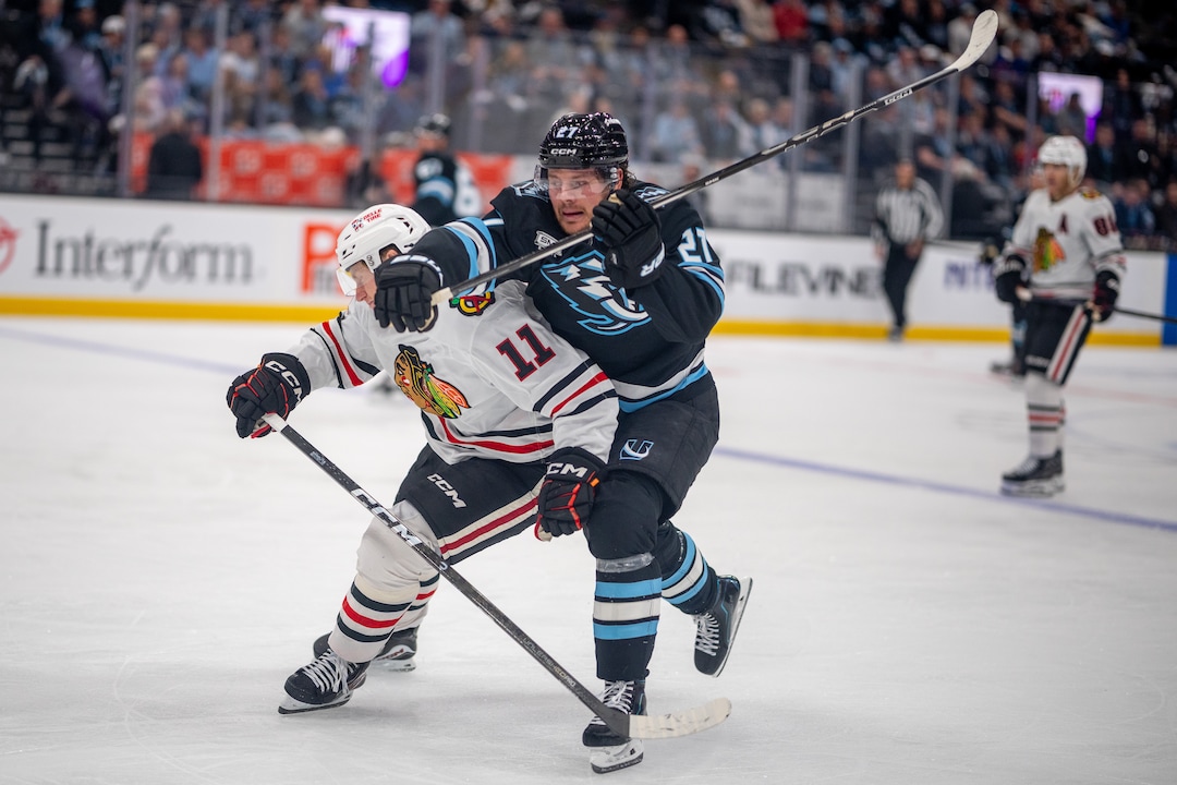 (Trent Nelson  |  The Salt Lake Tribune) Utah Mammoth center Barrett Hayton (27) and Chicago Blackhawks center Oliver Moore (11) as the Utah Mammoth host the Chicago Blackhawks, NHL hockey in Salt Lake City on Thursday, Oct. 1, 2026.