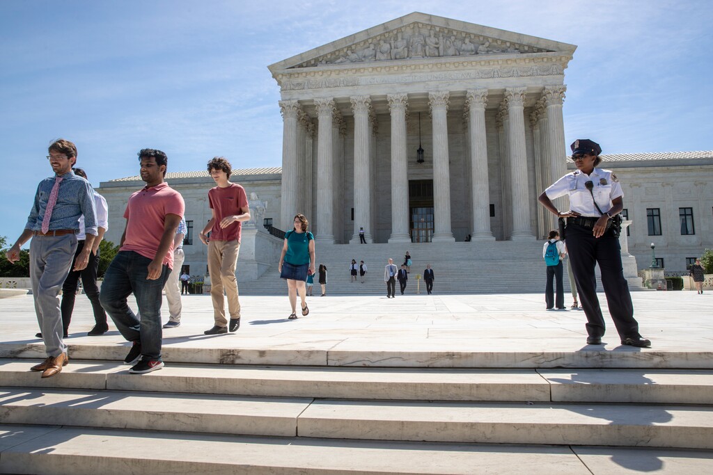 (J. Scott Applewhite | The Associated Press) Visitors depart the Supreme Court early Monday, June 25, 2018. The justices are expected to hand down decisions this week as the court's term comes to a close.