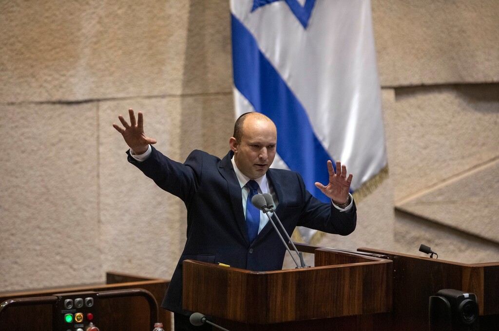 (Dan Balilty | The New York Times)

Naftali Bennett speaks during the Knesset session in Jerusalem, on Sunday, June, 13, 2021. Prime Minister Benjamin Netanyahu is set to be replaced by his former chief of staff and now political rival, Naftali Bennett.