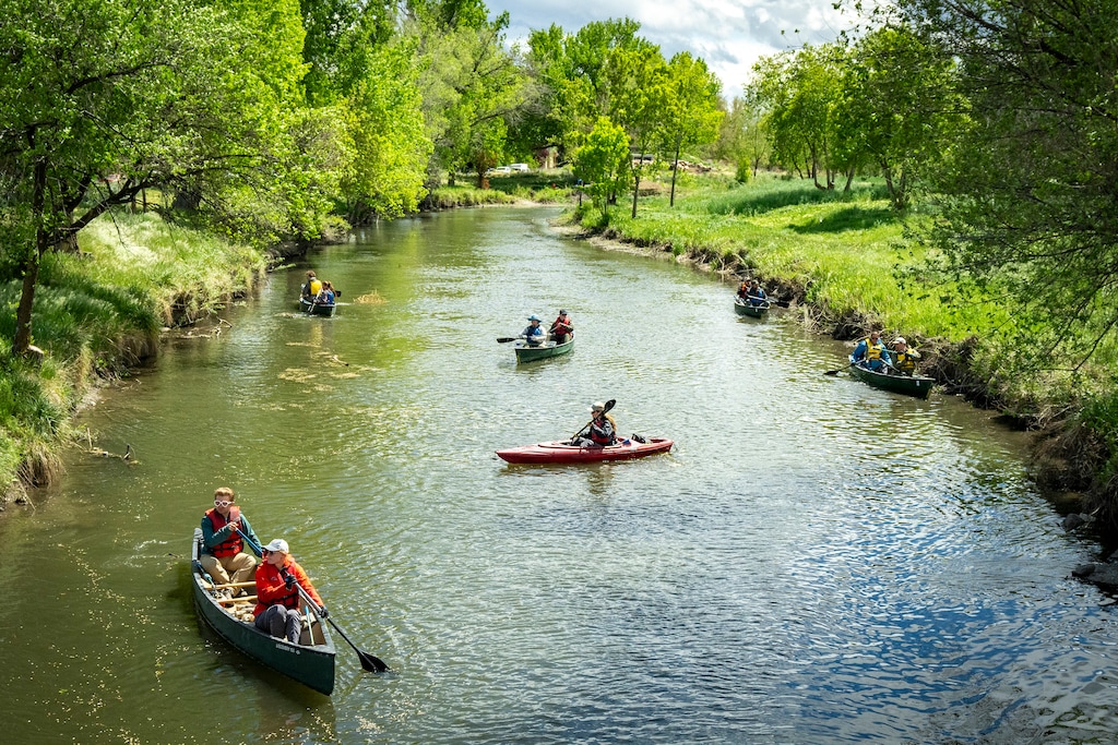 (Rick Egan | The Salt Lake Tribune) Volunteers paddle along the banks of the Jordan River on Wednesday, April 22, 2026, as the Jordan River Commission hosted an Earth Day kayak-based river cleanup on the Jordan River.