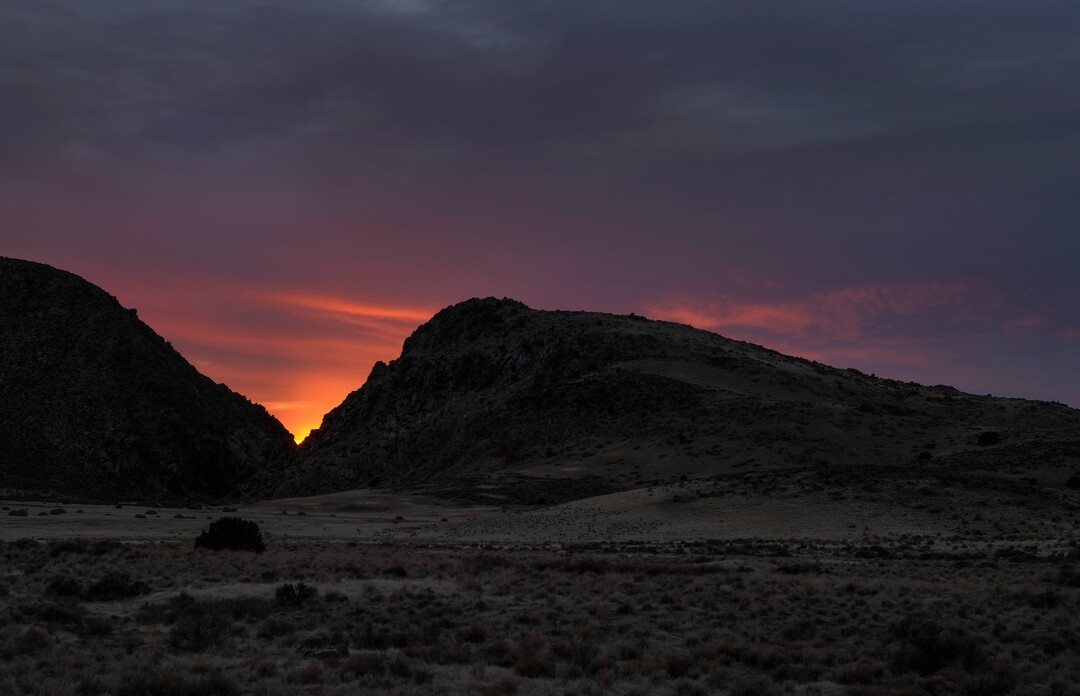 (Leah Hogsten | The Salt Lake Tribune)  The sun is shown setting within the vee of the Parowan Gap, a day prior to the spring equinox observance, Saturday, Mar. 19, 2021.