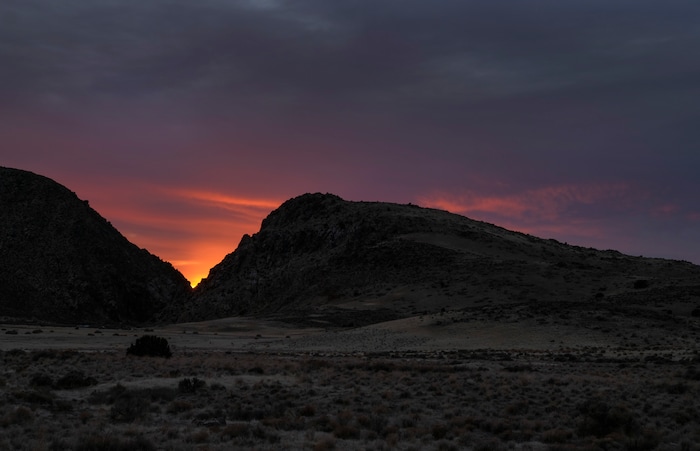 (Leah Hogsten | The Salt Lake Tribune) The sun is shown setting within the vee of the Parowan Gap, a day prior to the spring equinox observance, Saturday, Mar. 19, 2021.