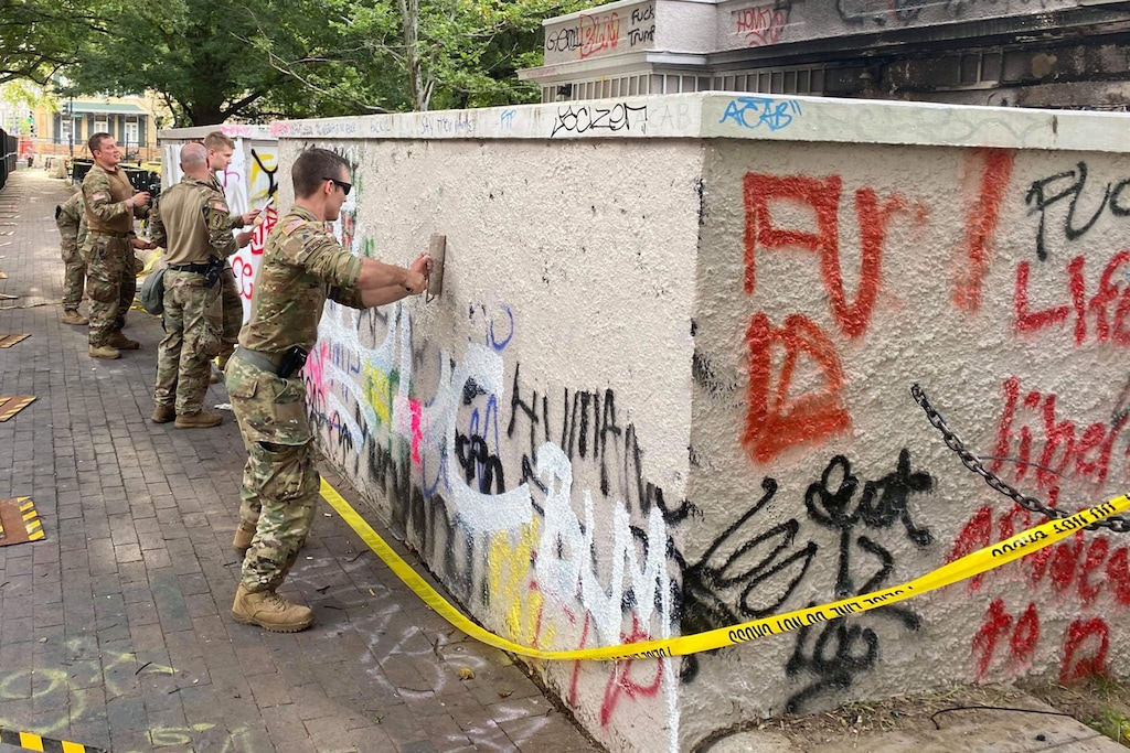 (Photo courtesy of Utah National Guard) National Guard members from Utah clean graffiti in Washington, D.C.