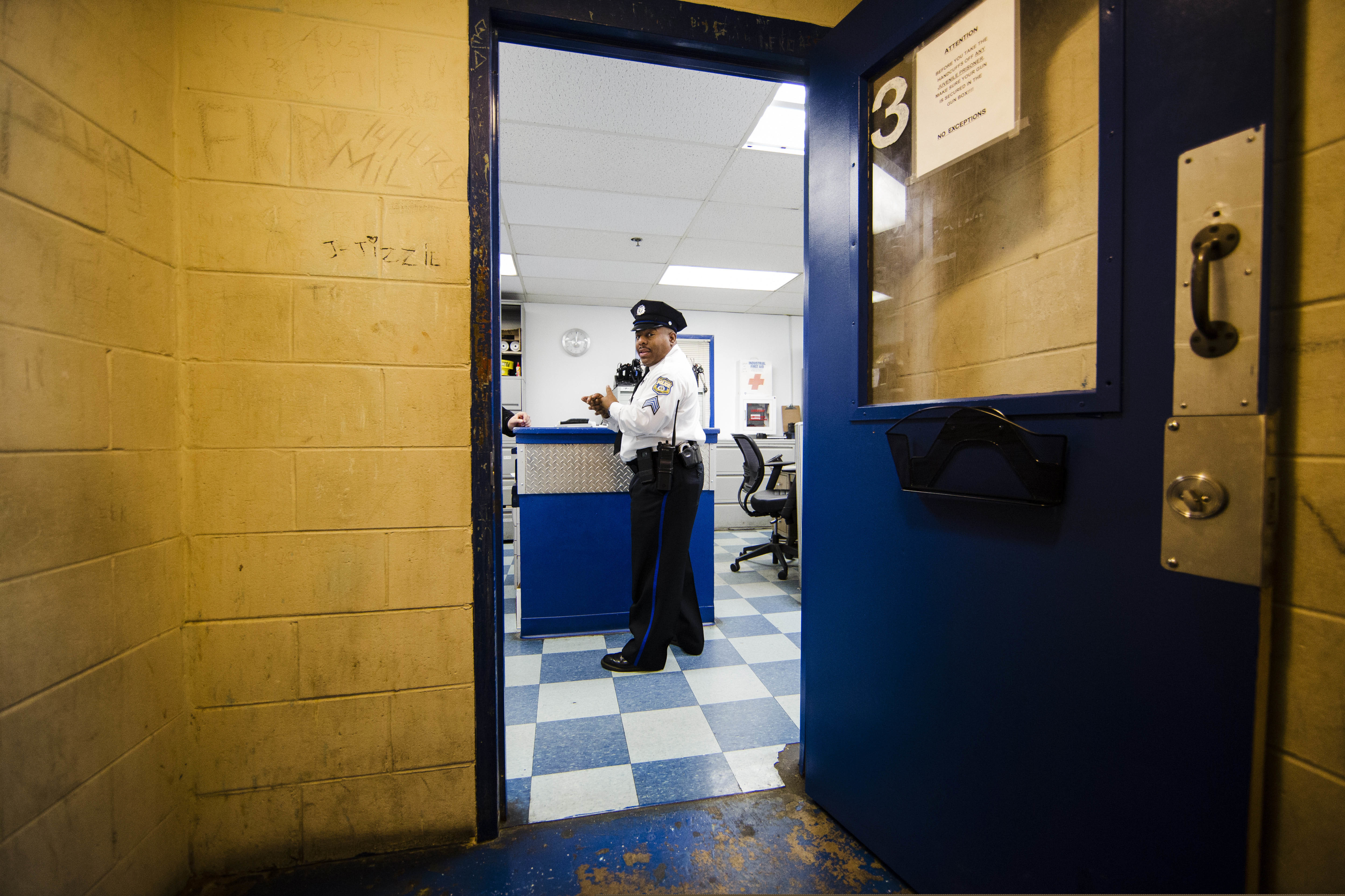 In this Friday, Oct. 26, 2018, photo, Philadelphia Police Sgt. John Ross discusses the Police 9th District's juvenile holding cell in Philadelphia. Bloomberg Philanthropies announced the winners Monday of the U.S. Mayors Challenge that asked cities to develop innovative solutions to their biggest problems that other cities could copy. Philadelphia plans to build a juvenile justice hub designed to make contact with police less traumatic, keep more children out of the criminal justice system and connect at-risk juveniles with intervention services at a crisis point that could change their lives. (AP Photo/Matt Rourke)