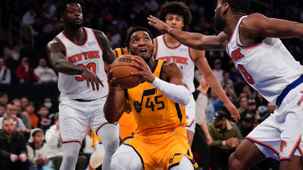 Utah Jazz's Donovan Mitchell, center looks to shoot during the second half of an NBA basketball game against the New York Knicks, Sunday, March 20, 2022, in New York. (AP Photo/Seth Wenig)