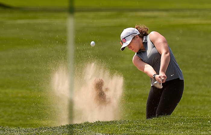 (Leah Hogsten | The Salt Lake Tribune) "Golf is the best game for social distancing,' said Utah pro golfer Sadie Palmer firing out of a trap at Rose Park Golf Course, April 9, 2020. Palmer said she was "grateful" to be playing with her three friends on Thursday instead of being holed up in the house. "The attitude is gratitude," she said.