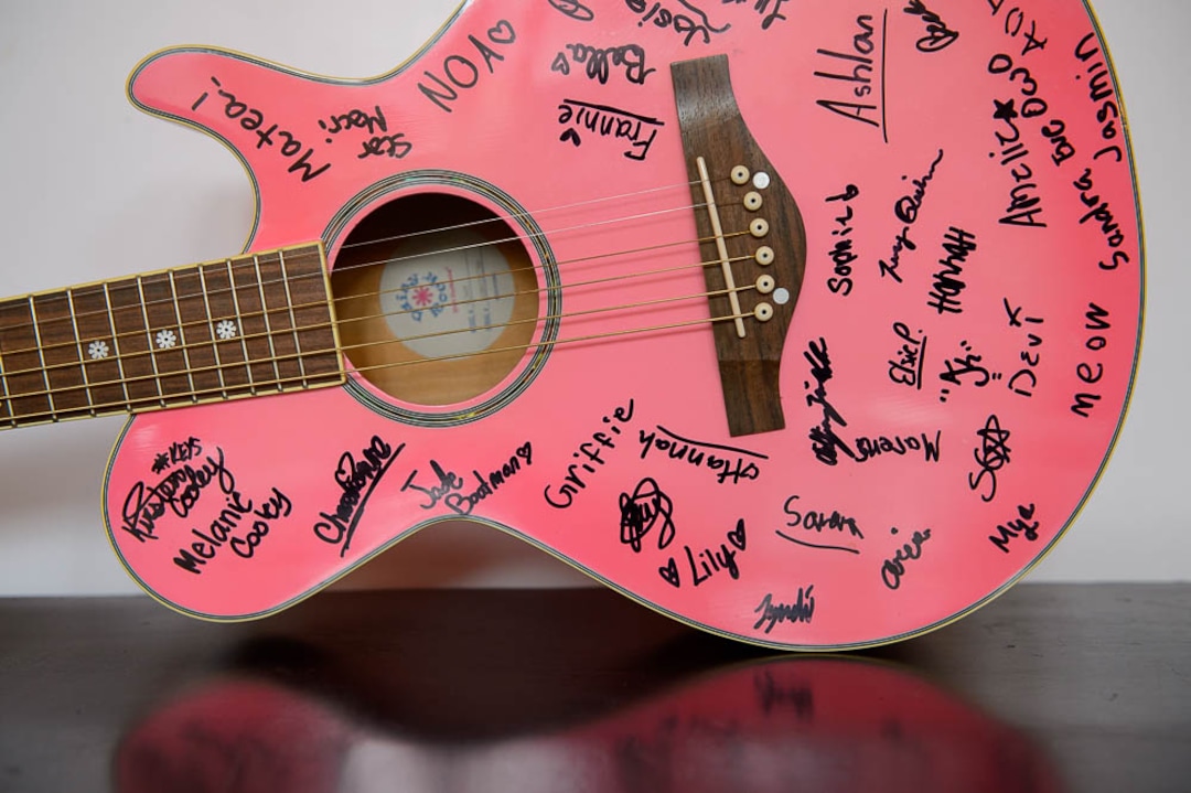 (Trent Nelson | The Salt Lake Tribune)  An autographed pink guitar at Rock Camp for Womyn.