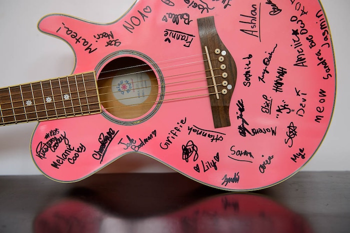 (Trent Nelson | The Salt Lake Tribune) An autographed pink guitar at Rock Camp for Womyn.