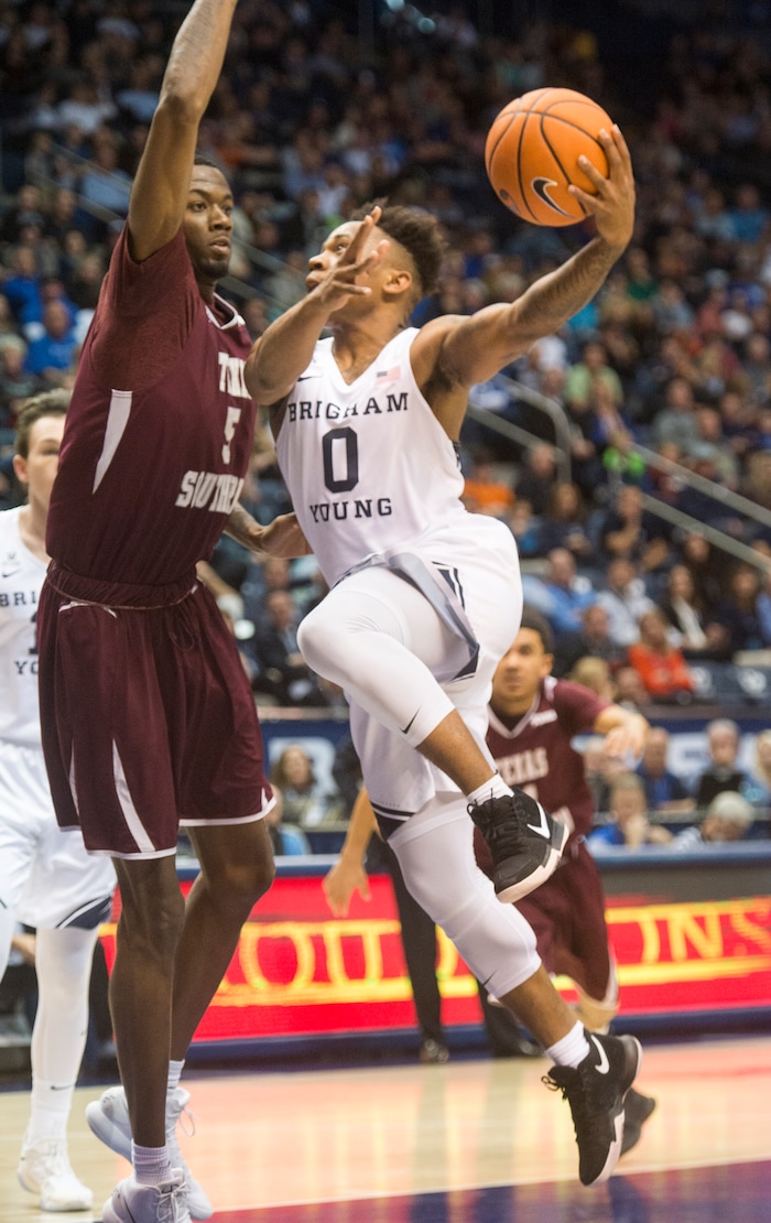 (Rick Egan  |  The Salt Lake Tribune)   Brigham Young Cougars guard Jahshire Hardnett (0) shoots over Texas Southern Tigers center Trayvon Reed (5), in basketball action, Brigham Young Cougars vs Texas Southern Tigers, at the Marriott Center in Provo, Saturday, December 23, 2017.