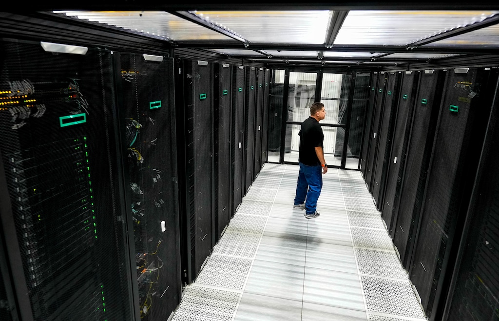 (Francisco Kjolseth | The Salt Lake Tribune) Lead tech for Data Bank SLC 3, Anselmo Chapa Garza, is pictured in the cold isle containment cage that houses what is ranked among the world’s fastest and greenest supercomputers, in a University of Utah data center facility in Bluffdale, pictured Tuesday, Aug. 18, 2026. 