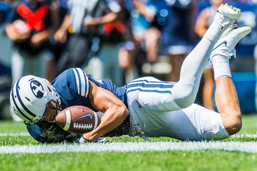 (Chris Detrick  |  The Salt Lake Tribune)  Brigham Young Cougars wide receiver Neil Pau'u (84) scores a touchdown during the game at LaVell Edwards Stadium Saturday, August 26, 2017.