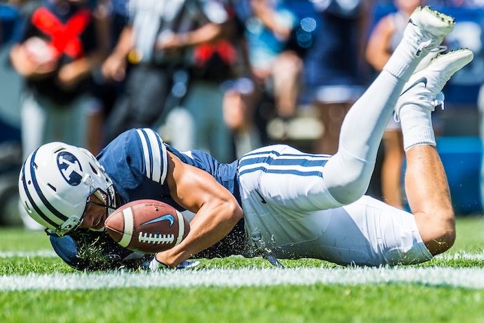 (Chris Detrick  |  The Salt Lake Tribune)  Brigham Young Cougars wide receiver Neil Pau'u (84) scores a touchdown during the game at LaVell Edwards Stadium Saturday, August 26, 2017.