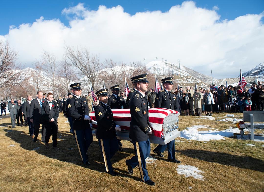 (Rick Egan  |  The Salt Lake Tribune)  The casket of Chief Warrant Officer 2 Kirk T. Fuchigami Jr. is carried into the cemetery by an Honor Guard for the graveside service at the Brigham City Cemetery, Monday, Dec. 9, 2019. Fuchigami was killed in Afghanistan last month.