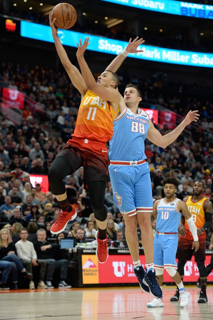 (Francisco Kjolseth  |  The Salt Lake Tribune)  Utah Jazz guard Dante Exum (11) gets past Sacramento Kings forward Nemanja Bjelica (88) in the NBA game at Vivint Smart Home Arena Wed., Nov. 21, 2018, in Salt Lake City.