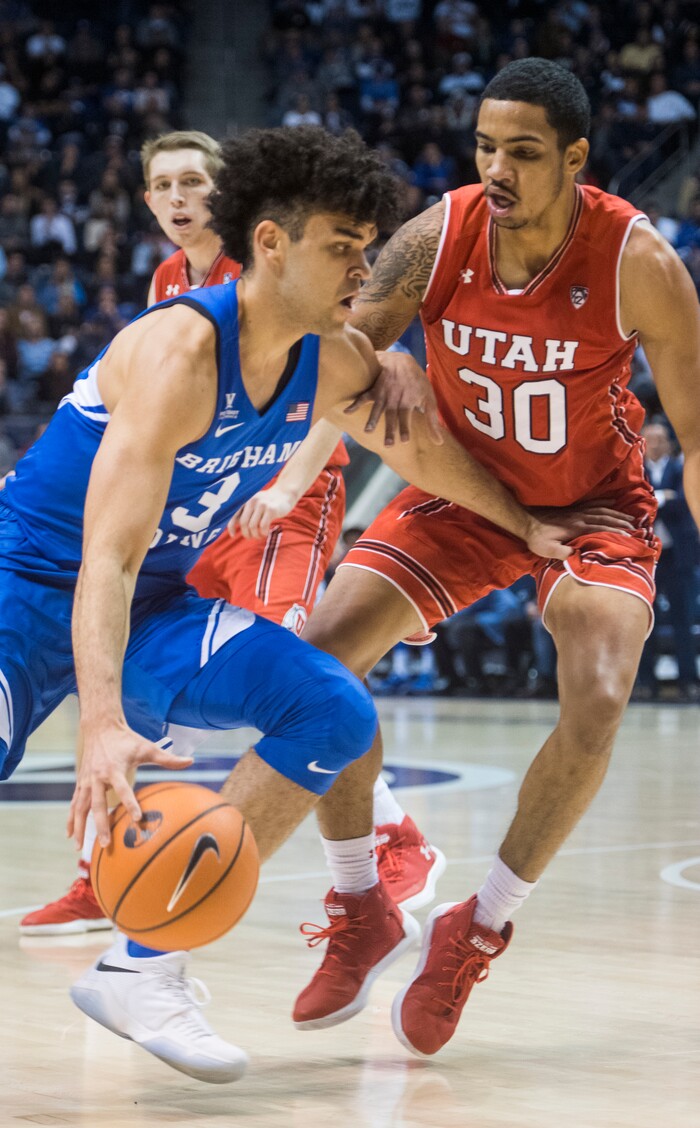 (Rick Egan  |  The Salt Lake Tribune)   Brigham Young Cougars guard Elijah Bryant (3) tries to take the ball inside, as Utah Utes guard Gabe Bealer (30) defends, in basketball action Utah Utes vs. Brigham Young Cougars at the Marriott Center in Provo, Saturday, December 15, 2017.


