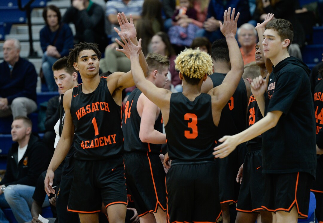 (Francisco Kjolseth  |  The Salt Lake Tribune)  Mike Saunders, #3, gets high fives from his team as Wasatch Academy competes in a tournament in Orem recently. 