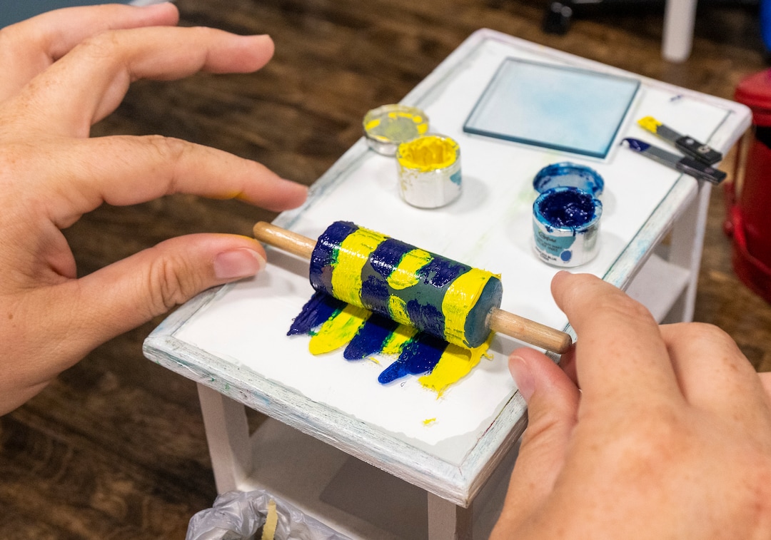(Rick Egan | The Salt Lake Tribune) Julie Jeffery makes a mono print in a miniature print shop at the14th annual Craft Lake City DIY FEST, at the Fair Park, Aug. 13, 2022.