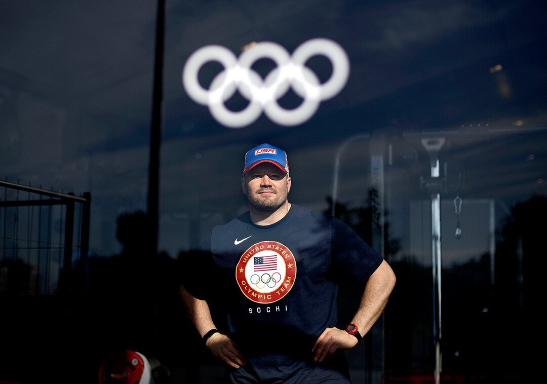 FILE - In this Feb. 4, 2014 file photo, United States bobsled pilot Steve Holcomb poses for photographers during a media tour of the fitness center in the Coastal Cluster athlete's village at the 2014 Winter Olympics, in Sochi, Russia. Avoiding what would have almost certainly been a widely boycotted world championships, international officials pulled this season's biggest bobsled and skeleton competition out of Russia on Tuesday, Dec. 13, 2016 after a number of sliders said they would not compete in a nation so enveloped in a doping scandal. (AP Photo/David Goldman, File)