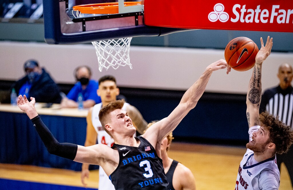 (Isaac Hale | Special to The Tribune) Brigham Young University forward Matt Haarms (3) blocks a shot from St. Mary's College guard Logan Johnson (0) during a game between the BYU Cougars and the Saint Mary’s College of California Gaels held at the Marriott Center in Provo on Saturday, Feb. 27, 2021.