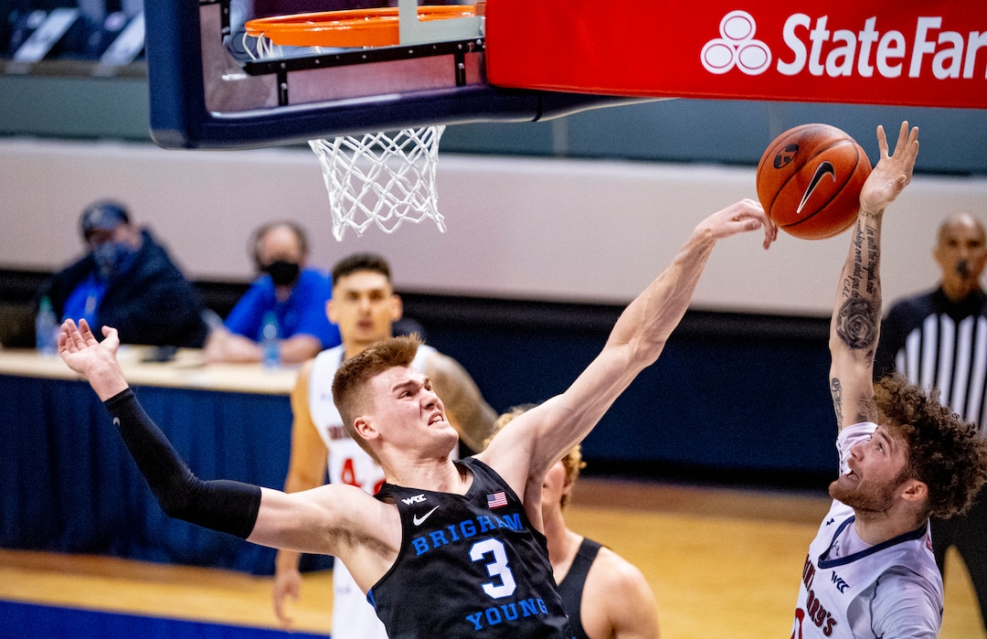 (Isaac Hale | Special to The Tribune) Brigham Young University forward Matt Haarms (3) blocks a shot from St. Mary's College guard Logan Johnson (0) during a game between the BYU Cougars and the Saint Mary’s College of California Gaels held at the Marriott Center in Provo on Saturday, Feb. 27, 2021.