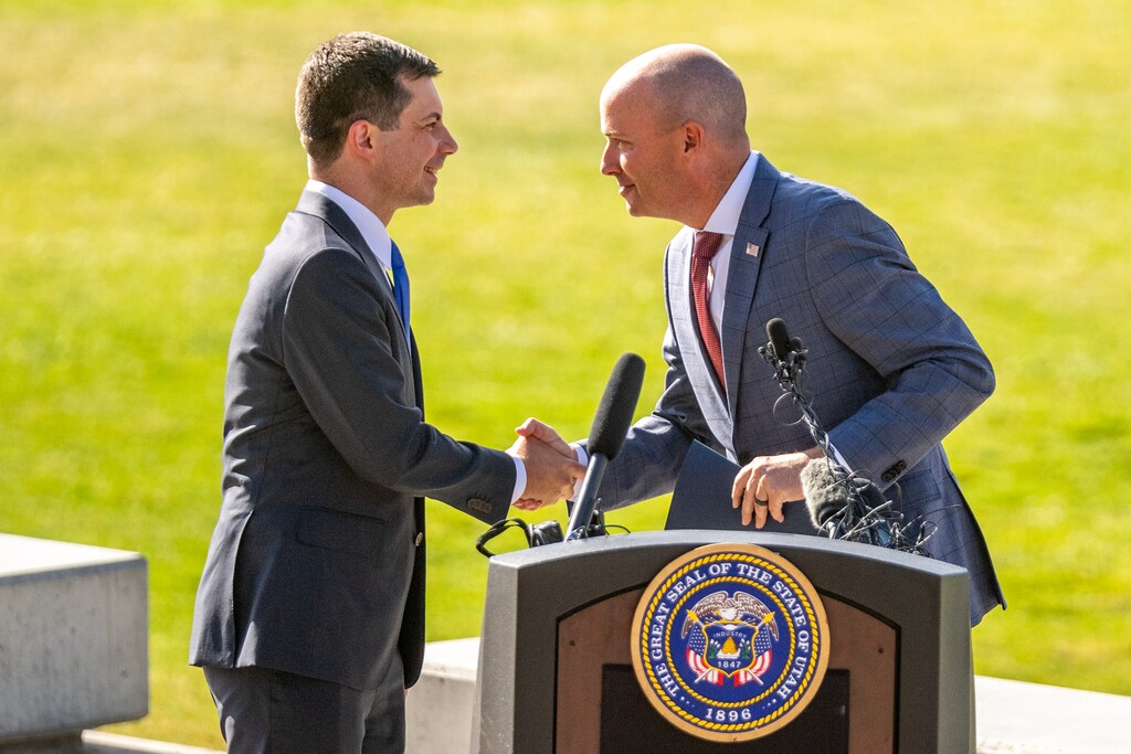 (Trent Nelson  |  The Salt Lake Tribune) Transportation Secretary Pete Buttigieg and Gov. Spencer Cox at a news conference at the Utah Capitol in Salt Lake City on Friday, July 29, 2022.
