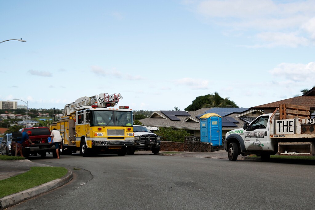 (Cindy Ellen Russell | Honolulu Star-Advertiser via AP) A Honolulu Fire Department ladder truck is seen near the scene in Kailua, where at least a man died and a few others were seriously injured while building a retaining wall in Honolulu on Friday, Dec. 30, 2022.
