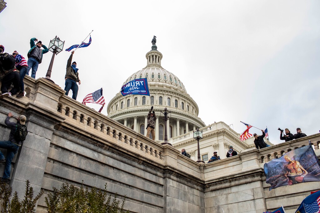 (Jason Andrew | The New York Times) Protesters on the Capitol in Washington on Wednesday, Jan. 6, 2021. The Capitol was placed on lockdown, with senators and members of the House locked inside their chambers, as Congress began debating President-elect Joe Biden’s victory. President Trump addressed supporters near the White House before protesters marched to Capitol Hill.