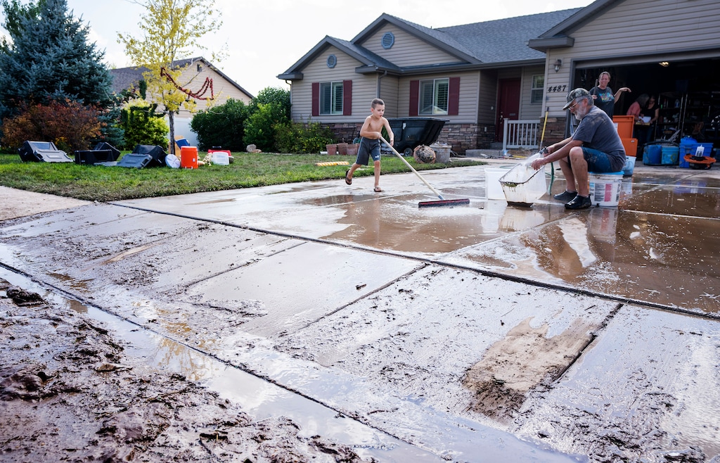 (Rick Egan | The Salt Lake Tribune) People clean up homes after heavy rains in Enoch on Monday, Aug. 2, 2021. Monsoon rains poured through southwest Utah again in 2022, but forecasters say it won't be enough to ease the ongoing drought.