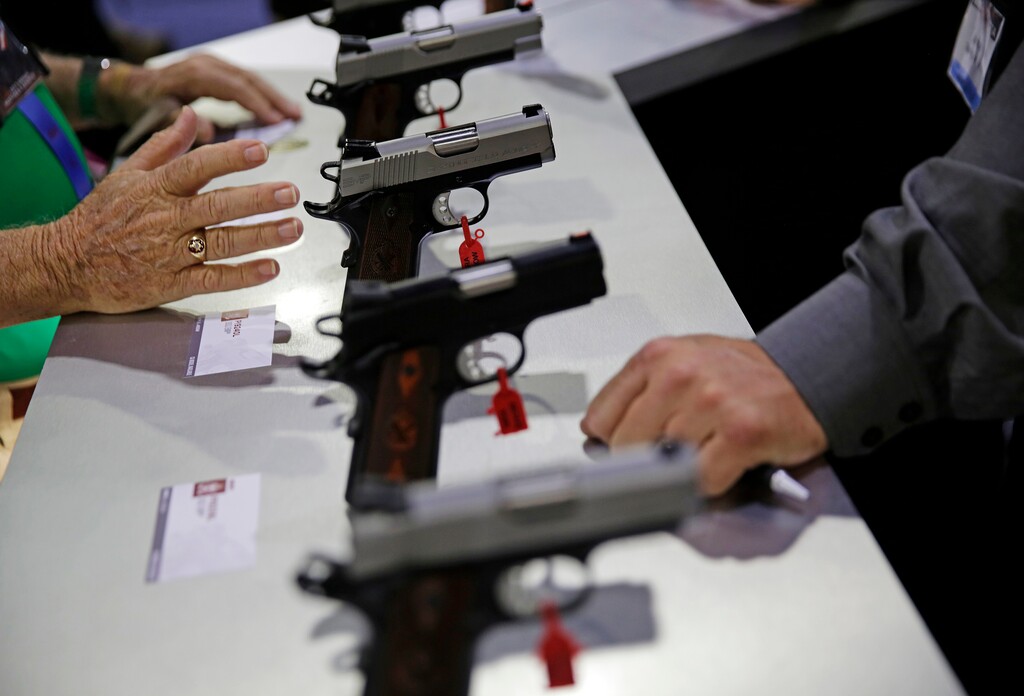 (David Goldman | The Associated Press) Guns sit on display at the NRA annual convention where President Donald Trump is scheduled to speak later in the day in Atlanta, Friday, April 28, 2017.
