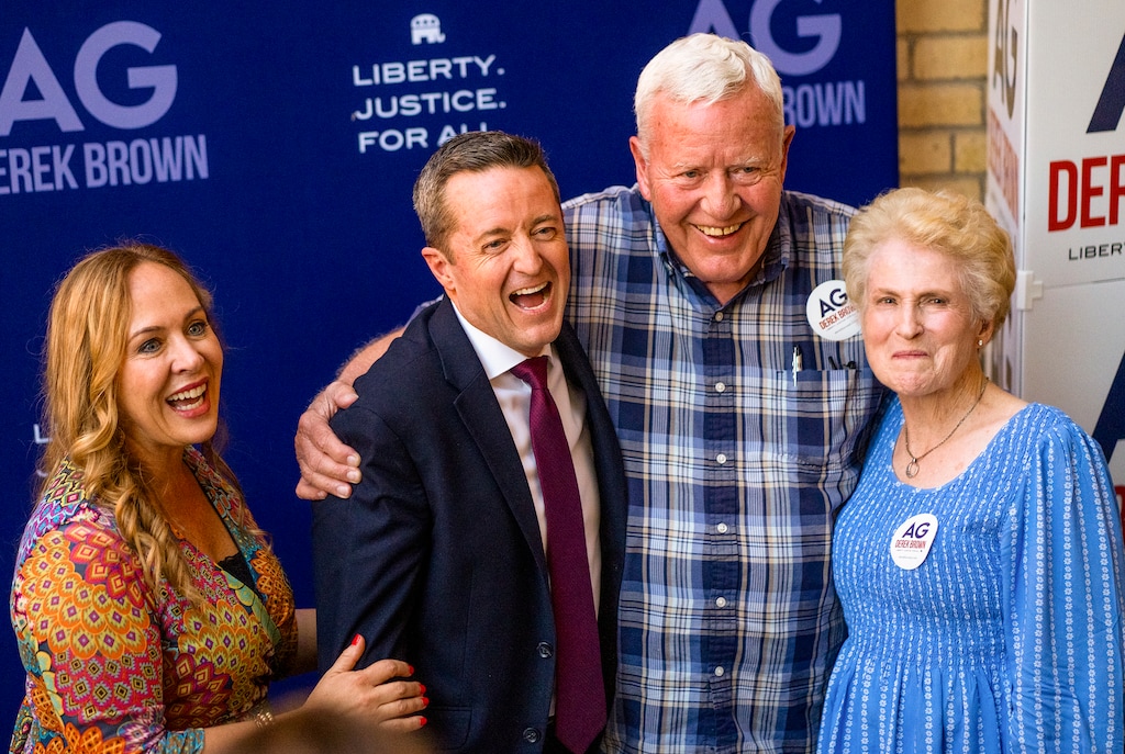 (Rick Egan | The Salt Lake Tribune) Utah attorney general candidate Derek Brown celebrates winning the GOP nomination with his wife and parents in Salt Lake City Tuesday, June 25, 2024.