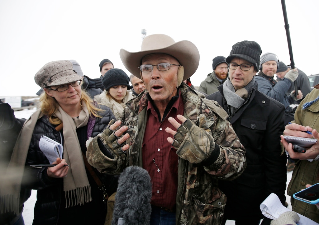 LaVoy Finicum, a rancher from Arizona, who is part of the group occupying the Malheur National Wildlife Refuge speaks with reporters during a news conference at the the refuge Tuesday, Jan. 5, 2016, near Burns, Ore. Law enforcement had yet to take any action Tuesday against the group numbering close to two dozen who are upset over federal land policy. Finicum said the group would examine the underlying land ownership transactions to begin to "unwind it," stating he was eager to leave Oregon. (AP Photo/Rick Bowmer)