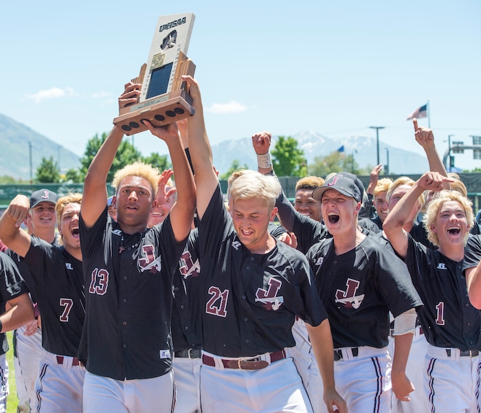 (Rick Egan  |  The Salt Lake Tribune)   Jordan High celebrates their 11-1 win over Olympus, for the 5A state baseball championship, at UVU in Orem, Friday, May 25, 2018.