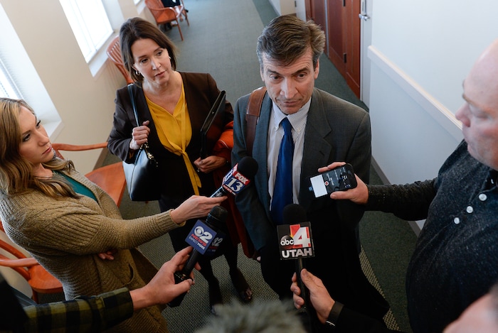 (Francisco Kjolseth  |  The Salt Lake Tribune)  Defense attorney's Greg and Rebecca Skordas discuss their clients case, former Brighton High and University of Southern California linebacker Osa Masina who had just been sentenced for sexual battery at the Matheson Courthouse in Salt Lake City on Tuesday, Dec. 5, 2017. Masina was sentenced to 365 days in jail, followed by two years on probation and won't be required to register as a sex offender.