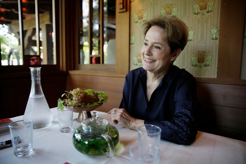 In this Aug. 25, 2017, photo, Alice Waters, founder of Chez Panisse restaurant, listens to questions during an interview at the restaurant in Berkeley, Calif. Waters' journey from a childhood of 1950s convenience cooking to the pinnacle of American cuisine is the subject of her new memoir, "Coming to My Senses: The Making of a Counterculture Cook." (AP Photo/Eric Risberg)