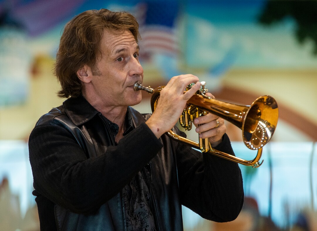 (Rick Egan  |  The Salt Lake Tribune)    Kurt Bestor plays the flugelhorn during an intimate one-man show at Shriners' Hospital, Tuesday, Nov. 19, 2019.