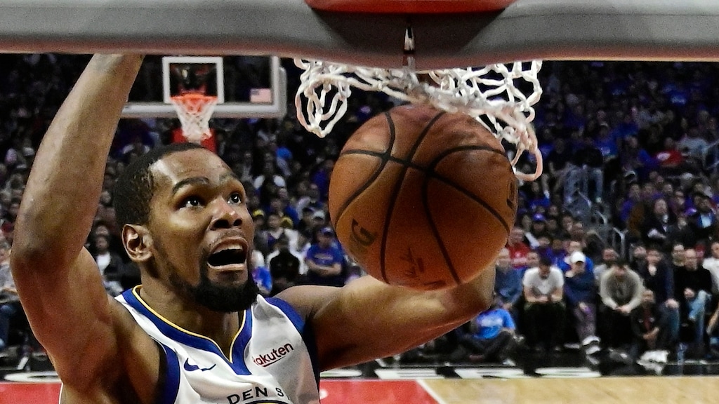 FILE - In this April 21, 2019, file photo, Golden State Warriors forward Kevin Durant, top, dunks as Los Angeles Clippers guard Landry Shamet defends during the second half in Game 4 of a first-round NBA basketball playoff series in Los Angeles. Rarely relevant at the same time on the basketball court, the Knicks and Nets are front and center in the free agency race, two of the teams best positioned to make a splash when the market opens.
Both can afford two top players, with hopes of landing not only a Kevin Durant or Kyrie Irving, but possibly even both. (AP Photo/Mark J. Terrill, File)