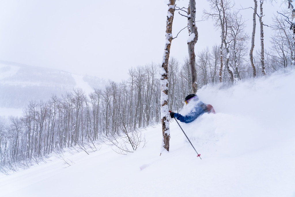 (Kyler Tingey | Park City Mountain) A skier cuts through the powder at Park City Mountain Resort during the 2022-23 season.