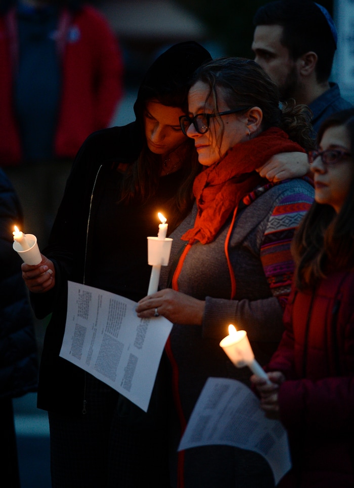 Leah Hogsten | The Salt Lake Tribune Candles are lit and prayers are given outside Chabad Lubavitch of Utah as members of Utah's Jewish and interfaith communities held a vigil and prayer service, Monday, Oct. 29, 2018 for the 11 people killed at the Tree of Life Synagogue in Pittsburgh, Monday, Oct. 29, 2018, "for peace, harmony and love to once again reign supreme upon this Earth."