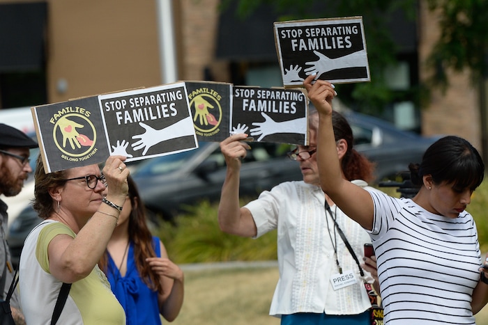 (Francisco Kjolseth  |  The Salt Lake Tribune)  Activists stage a protest against a private prison company with contracts to hold undocumented immigrants on Thursday, July 12, 2018, at the headquarters of Management and Training Corporation in Centerville.