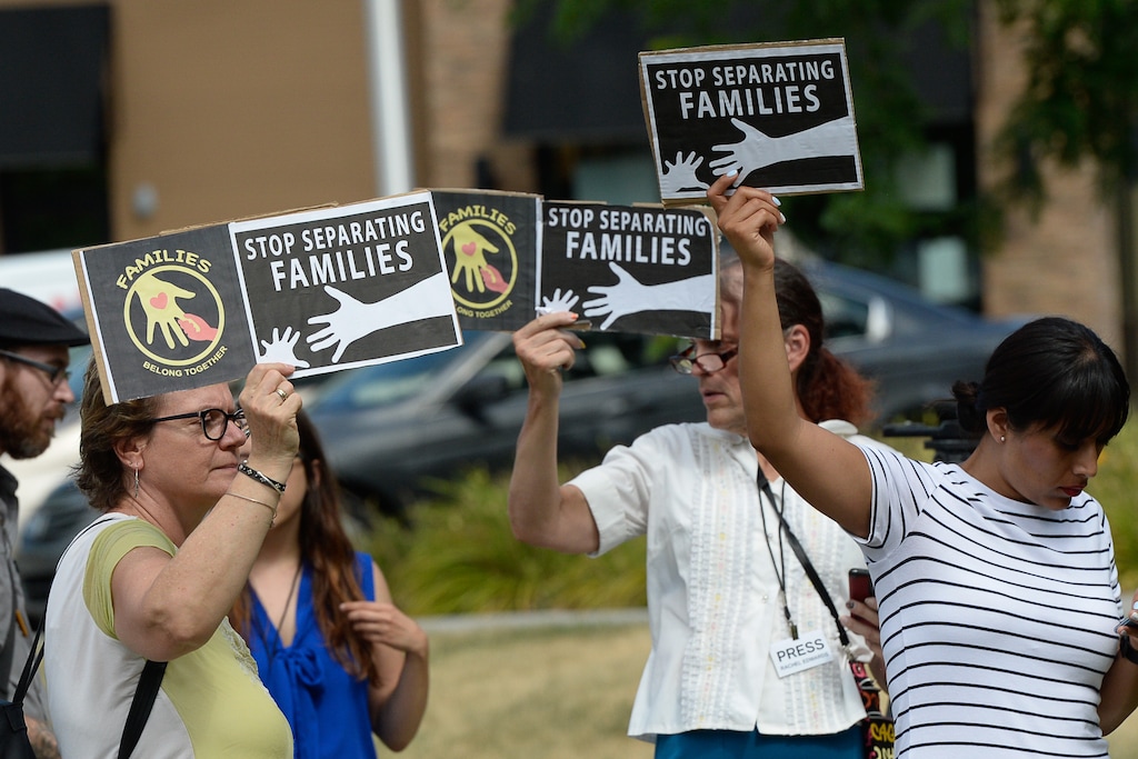 (Francisco Kjolseth | Tribune file photo) In this July 12, 2018, photo, activists stage a protest at the private Centerville, Utah, offices of Management & Training Corporation, a private prison company with contracts to hold undocumented immigrants and plans to bid on a project to build an immigrant detention center in Evanston, Wyo., for those with cases in Salt Lake City's immigration court. The company has now withdrawn from the Evanston project without explanation.