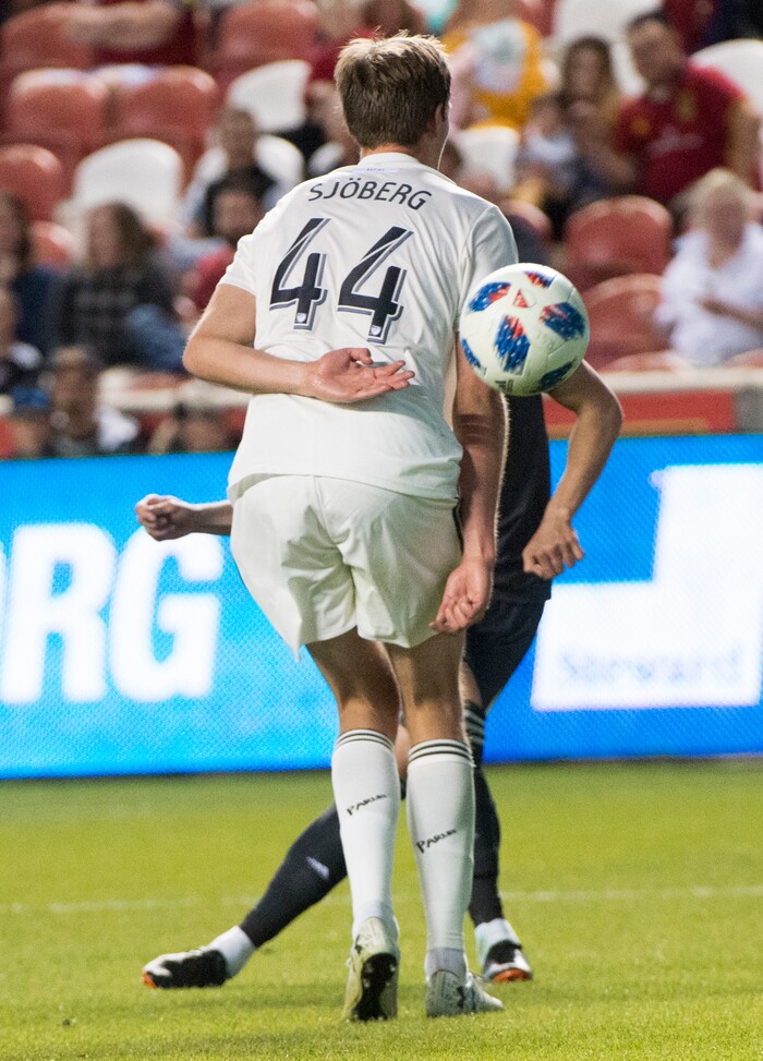 (Rick Egan  |  The Salt Lake Tribune) Real midfielder Damir Kreilach (6) bends the ball around defender Colorado Rapids defender Axel Sjoberg (44) for a Salt Lake goal, in MLS soccer action, between Real Salt Lake and Colorado Rapids,  at Rio Tinto Stadium, Saturday, April 21, 2018.



