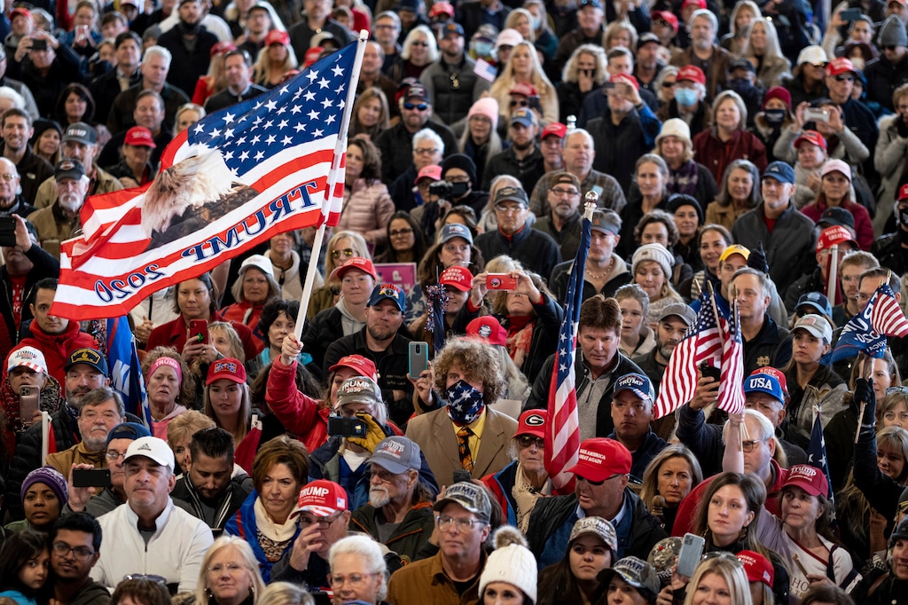 Supporters listen to speakers during the "Stop the Steal" rally with attorneys Lin Wood and Sidney Powell in Alpharetta, Ga., on Wednesday, Dec. 2, 2020. (Ben Gray/Atlanta Journal-Constitution via AP)